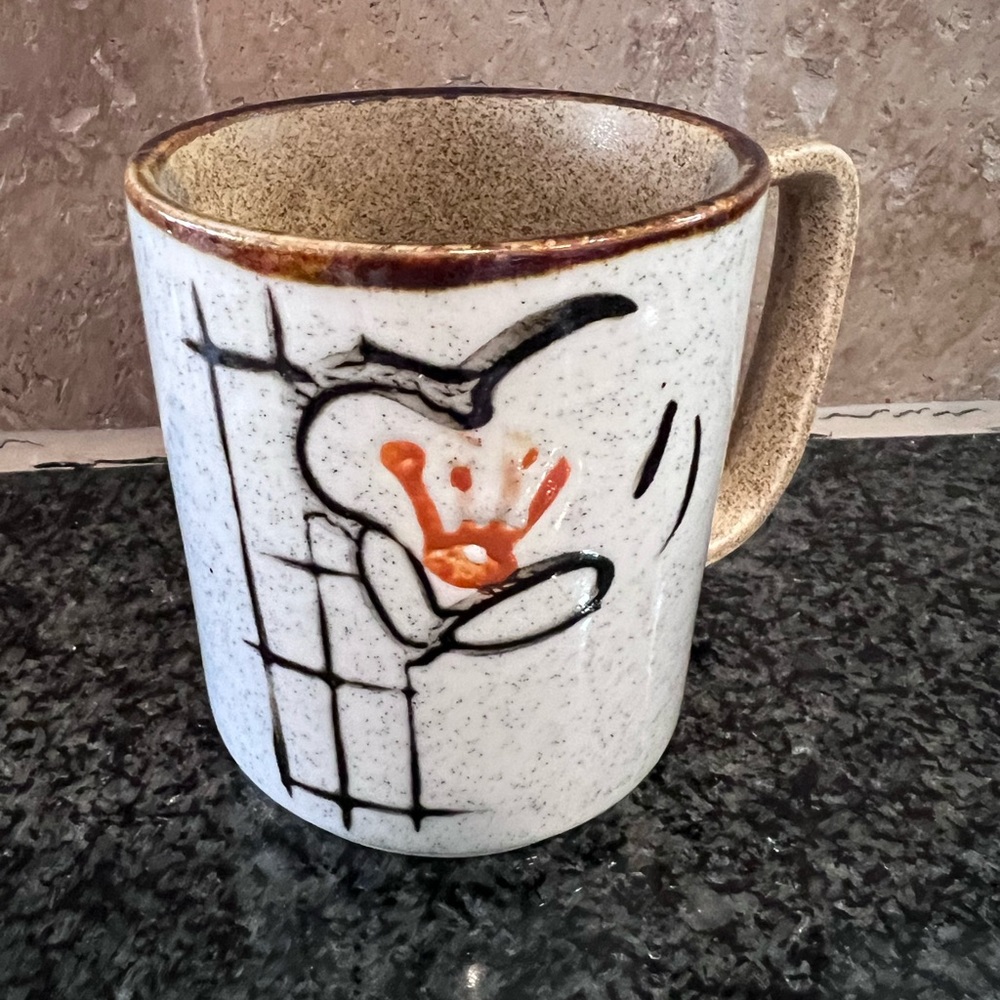 Vintage small coffee/tea mug. Has speckled ceramic glaze.